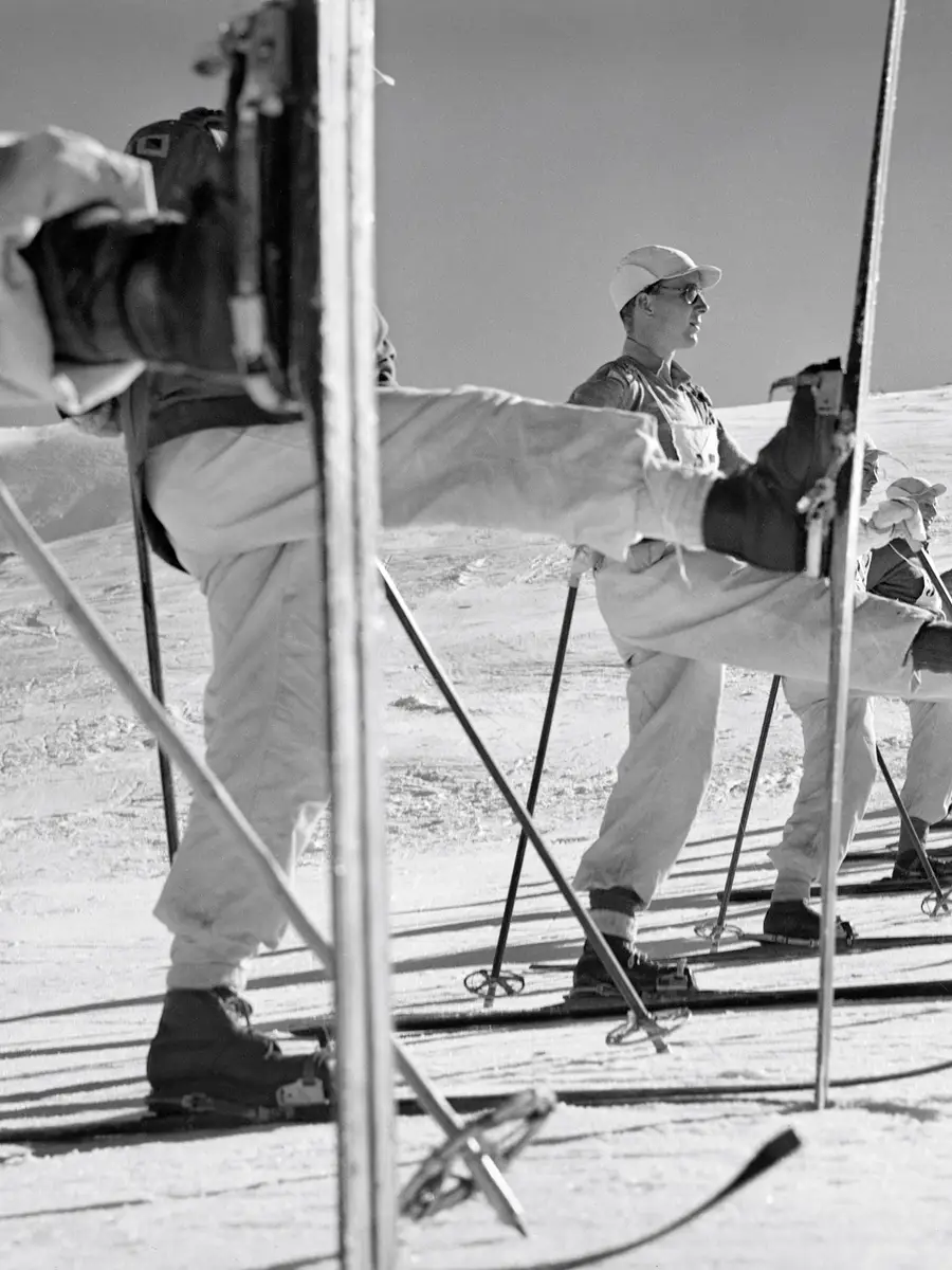 Members of the ski school line up to practice the kick turn.
