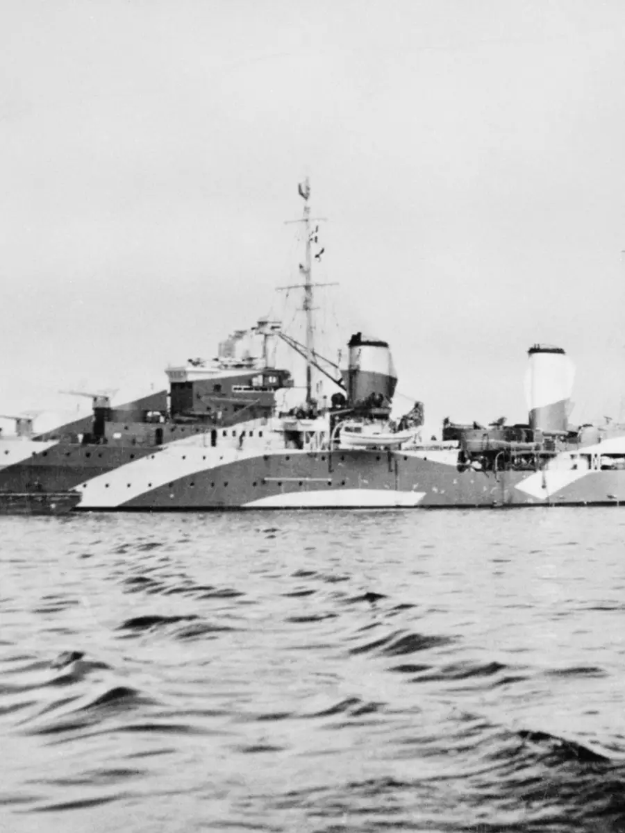 HMAS Perth at sea in a camouflage scheme. 