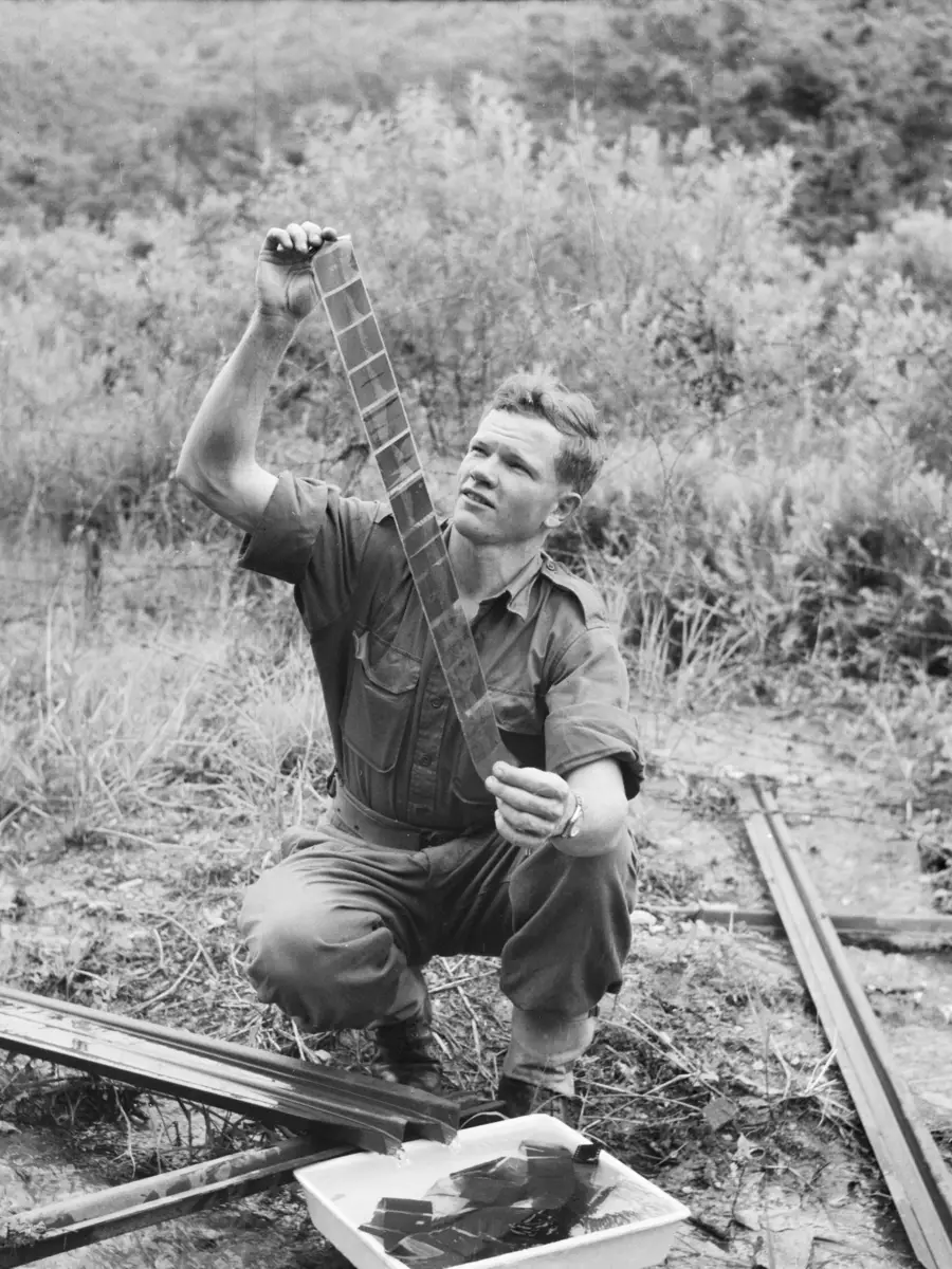 Private John ‘Dogger’ Dick examining his negatives