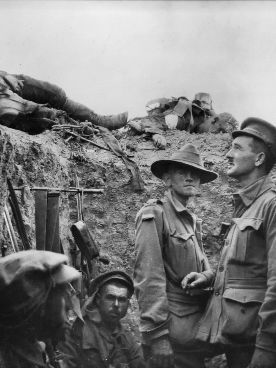 In a captured trench at Lone Pine, Major Leslie Morshead (right) looks at Australian and Turkish dead lying on top of the parapet.