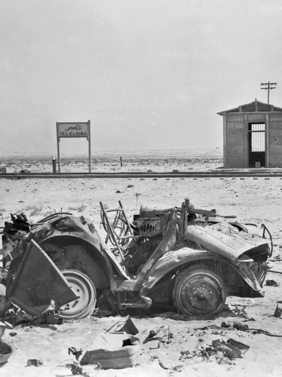 A VIEW OF THE RAILWAY STATION AT TEL ELEISA, SCENE OF SOME OF THE MOST INTENSIVE FIGHTING EXPERIENCED BY OUR FORCES AT PRESENT ENGAGED IN THE WESTERN DESERT. TEL EL EISA IS THE ARABIC FOR "HILL OF JESUS". (NEGATIVE BY HURLEY).