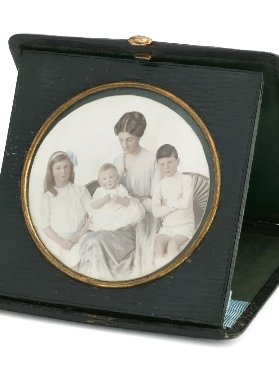 Black leather case contains a hand-coloured photograph of Lieutenant Colonel White's family.