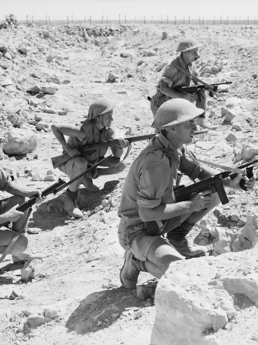 An Australian patrol lays up in an anti-tank ditch near the perimeter of the Australian defences around Tobruk  