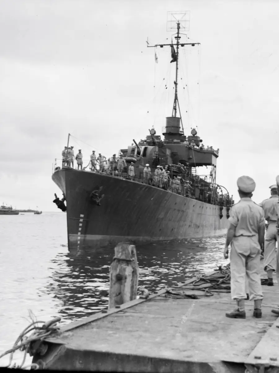 HMAS Diamantina pulling into the wharf