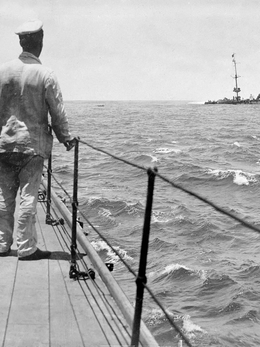 A sailor of HMAS Sydney looking at the wreck of SMS Emden, beached off North Keeling Island, November 1914