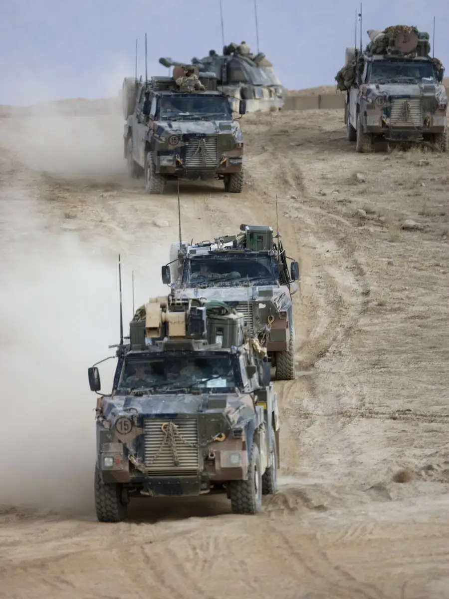 A convoy of Bushmasters of the 3RAR depart the Tarin Kowt Range