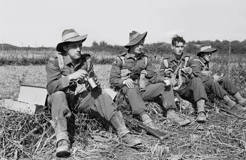 Harris (left) takes a break after 3RAR's first battle at the Apple Orchard.