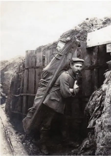 A German stretcher bearer carrying a patient to an Aid Post. 