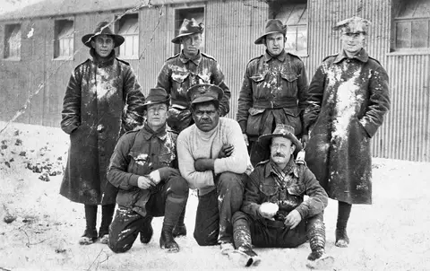 Group portrait of Australian soldiers, some of whom are members of the 60th Battalion