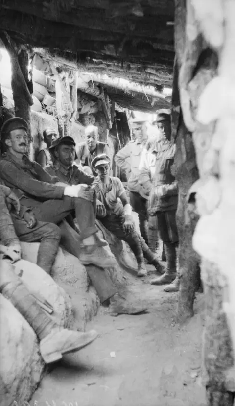 Australian soldiers in covered trenchs AWMG01126