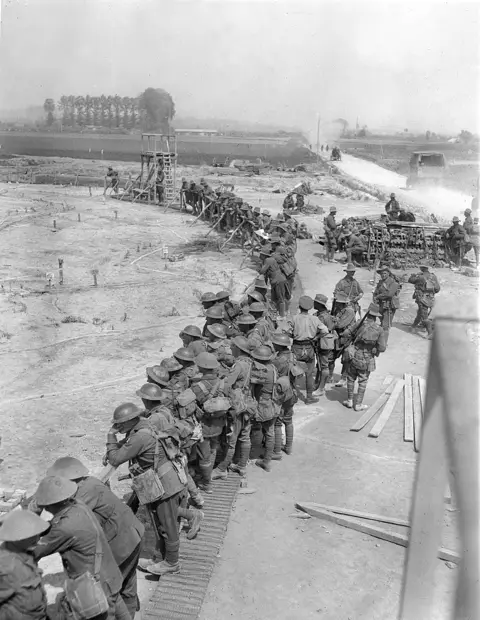 Australian infantry study a mocked-up battlefield in preparation for the attack at Messines  in 1917. E00648