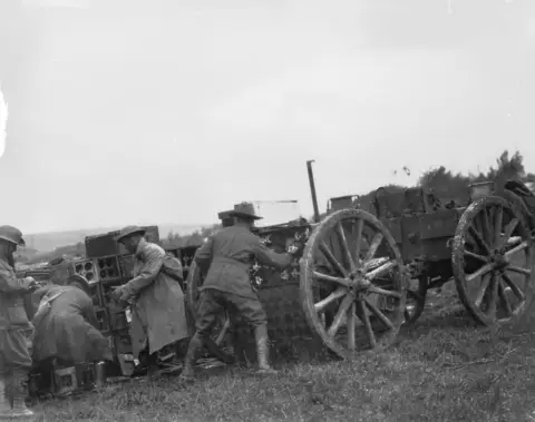 Australians  loading ammunition from  a dump near Hargicourt  to rush to their guns  in support of the 29  September attack on the Hindenburg Line. E03509