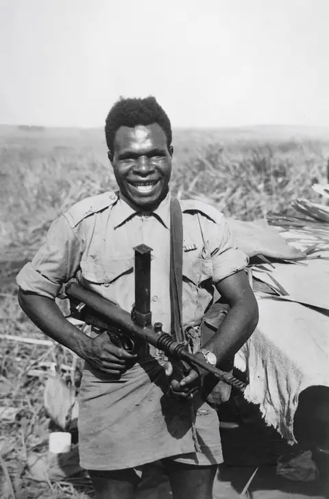 Corporal Sala outside holding gun