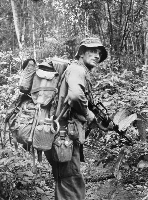 Sergeant Peter Buckney of D Company, 8RAR, patrolling in the dense jungle