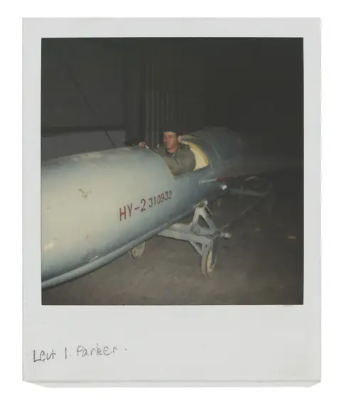 Parker sits in the Silkworm missile.