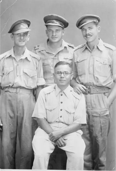 Boonpong Sirivejjabhandu (seated) with members of the Allied War Graves Commission