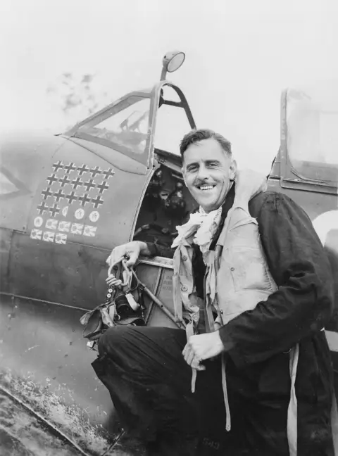 Group Captain Clive Caldwell with his Supermarine Spitfire MK VIII