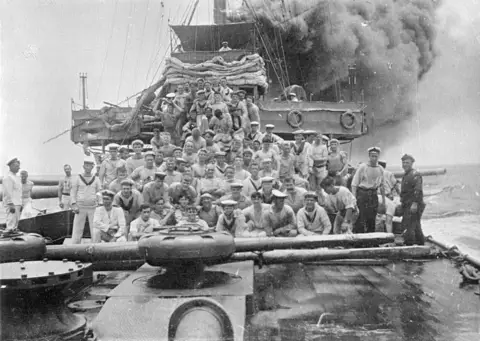 Group portrait of unidentified seamen on board HMAS Sydney.