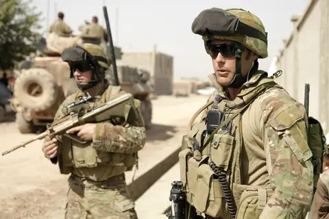 Australian soldiers conduct a security patrol outside the Australian funded Malalai Girls School in Tarin Kot in 2011.