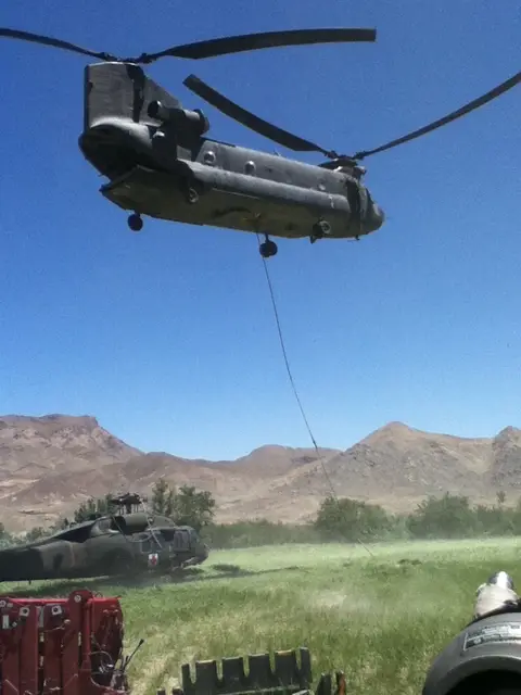 Australian Chinook A15-102 prepares to transport a downed American Black Hawk helicopter, Zabul province