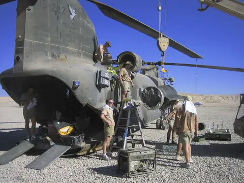 Ground crew work on replacing one of A15-202’s engines, Kandahar Airfield, October 2009.