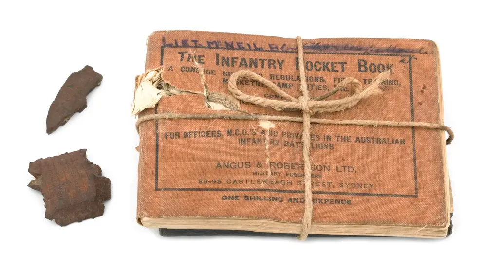 Shrapnel and MacNeil's pocketbooks that saved his life in June 1916. 