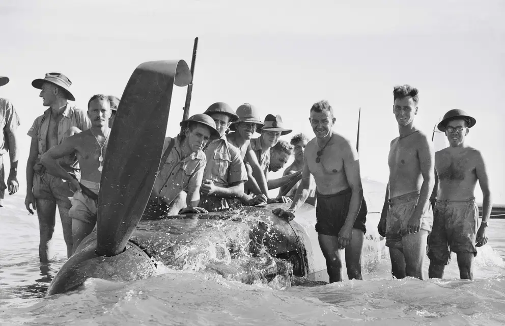 A Spitfire which made a forced landing on the beach during a Japanese air raid on Darwin