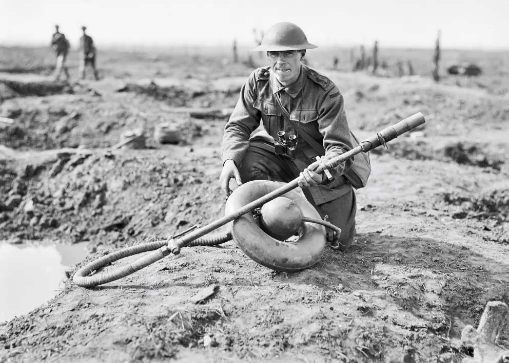 Lieutenant Leslie Bowman Cadell, 6th Battalion, holding a German Wechselapparat (Wex) M 1917 flamethrower 