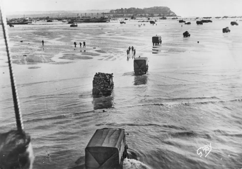 British or Canadian vehicles head toward the beach during the invasion of Normandy