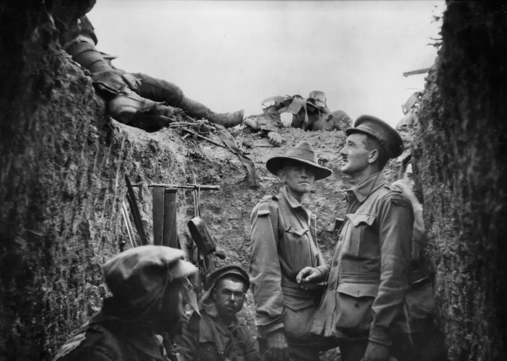 In a captured trench at Lone Pine, Major Leslie Morshead (right) looks at Australian and Turkish dead lying on top of the parapet.