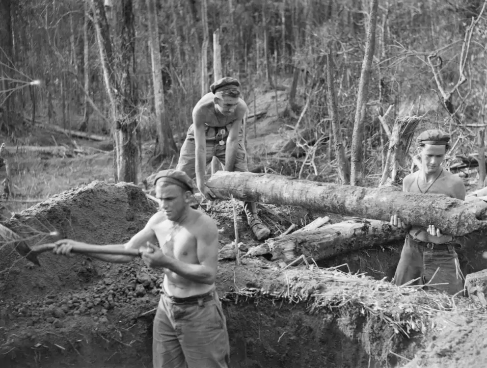 Three men in a weapon pit on Egan's Ridge