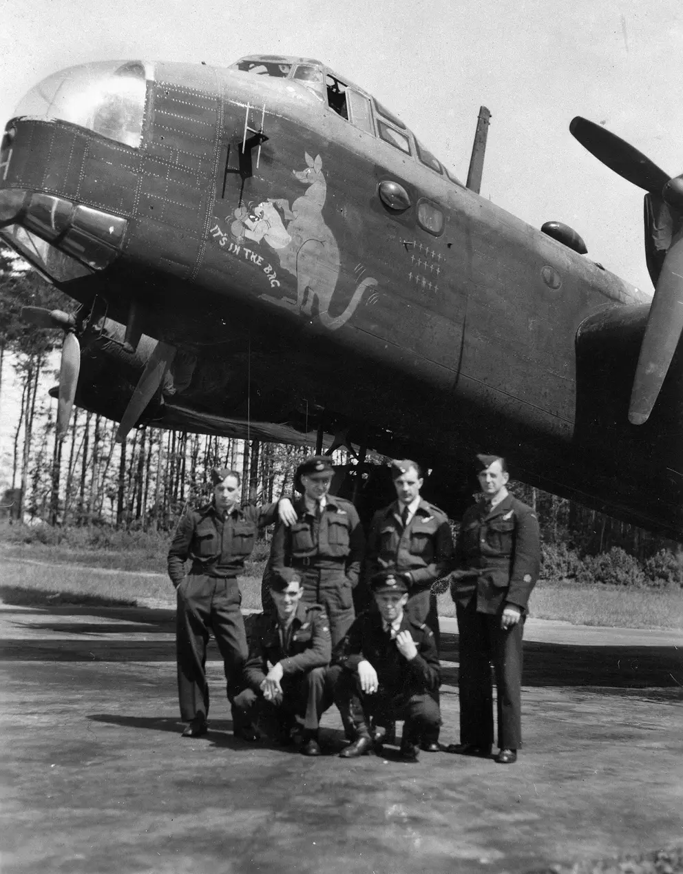Shepherd's Grove, England. Informal group portrait of an air crew of No 196 Squadron RAF, beside their Stirling IV aircraft (7T-H). AWM P02345.005