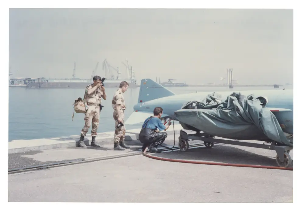 Parker showing French Navy divers how to flush through the Silkworm missile's fuel tanks. 
