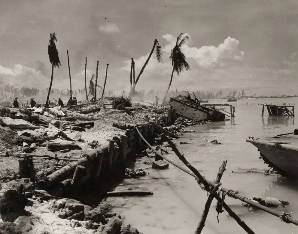 The Japanese had constructed coconut log and coral-stone seawalls that prevented most LVTs advancing. The bodies of Marines in the lagoon. Photo credit Marine Corps Photo 5-7 US Naval History and Heritage Command Collection