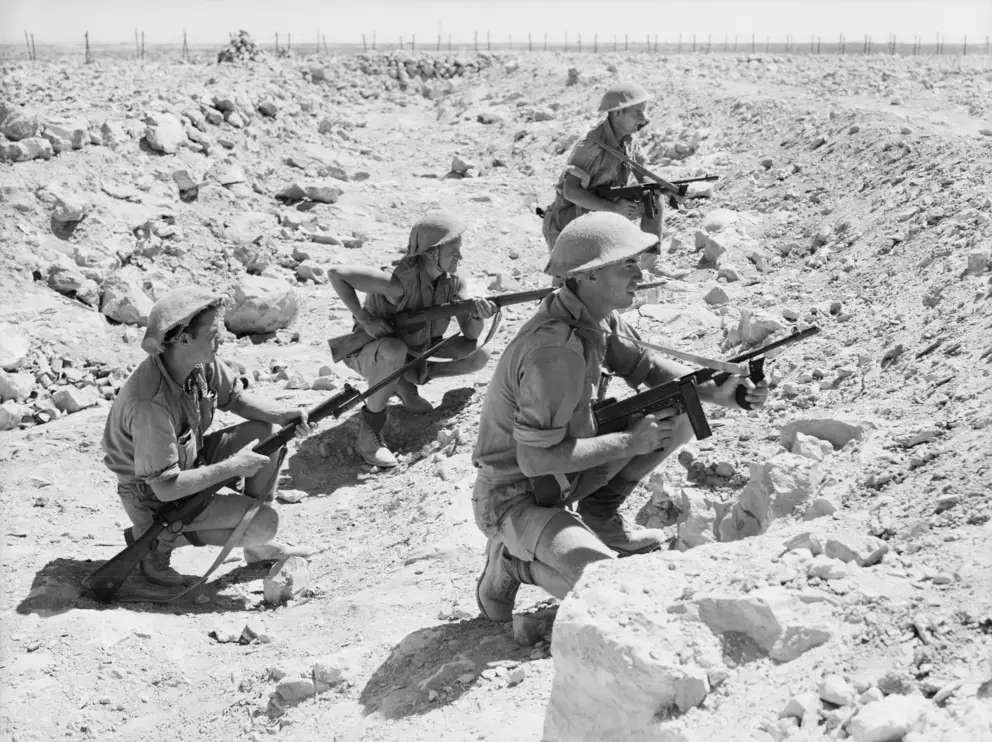 An Australian patrol lays up in an anti-tank ditch near the perimeter of the Australian defences around Tobruk  