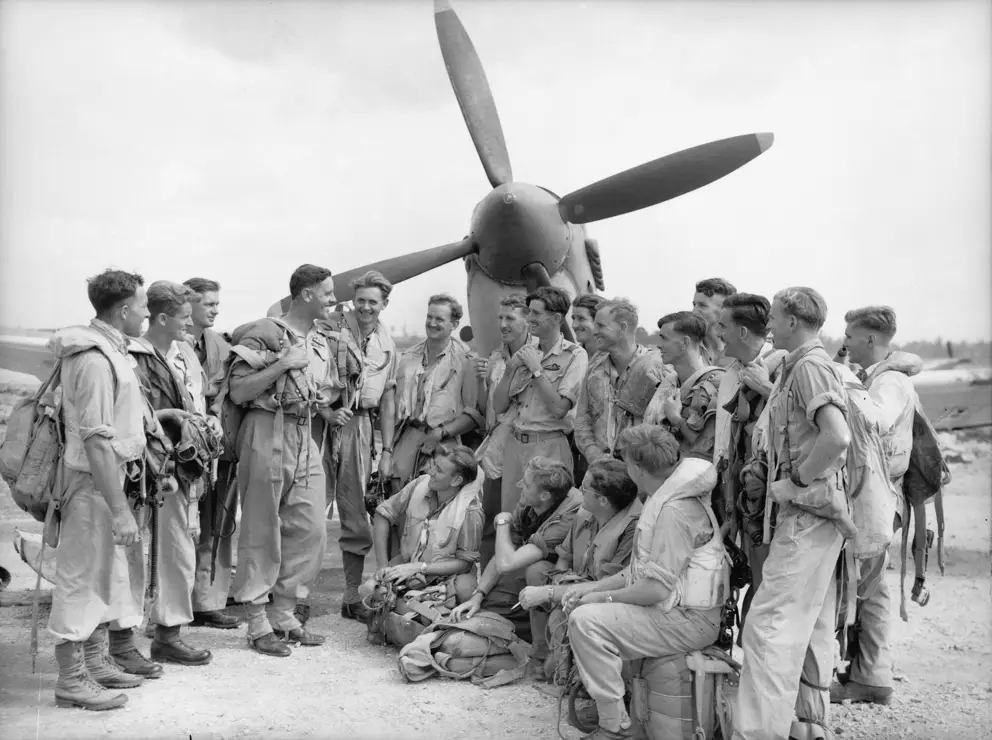 Caldwell (fourth from left) talking to No. 452 Squadron Spitfire pilots at Morotai 1945